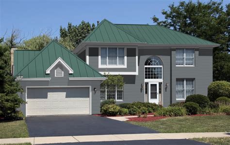 grey house with green metal roof|grey house with green shutters.